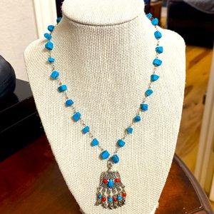 Silver chain with blue stone and orange accents